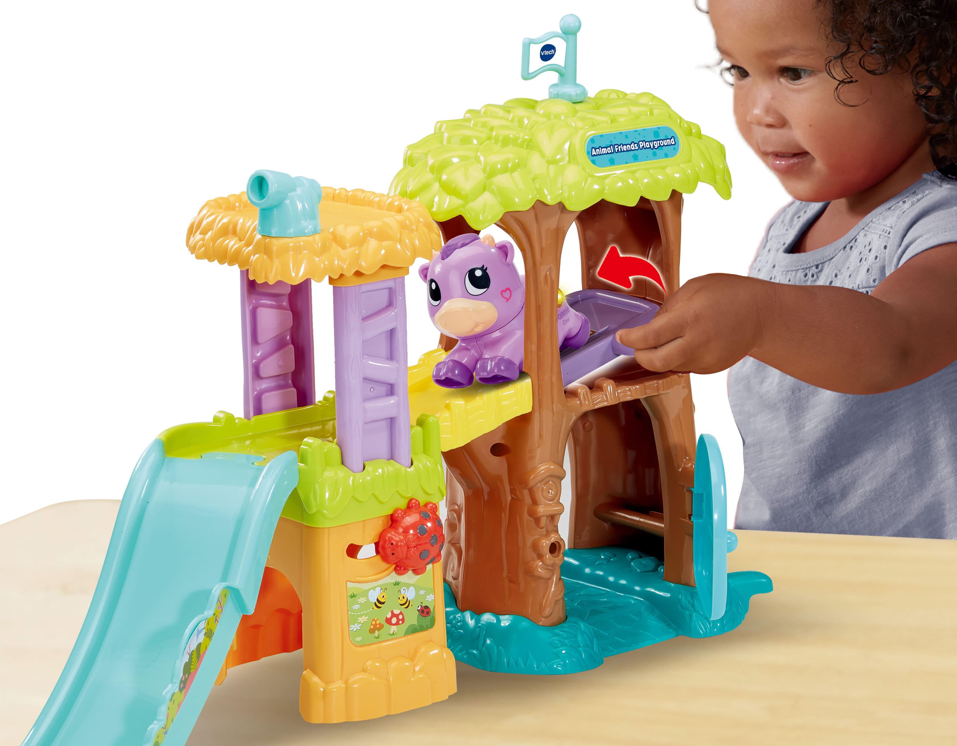 Lift the platform to see Connie Cow slide down the fun slide!